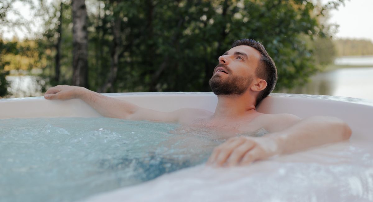 man relaxing in swim spa