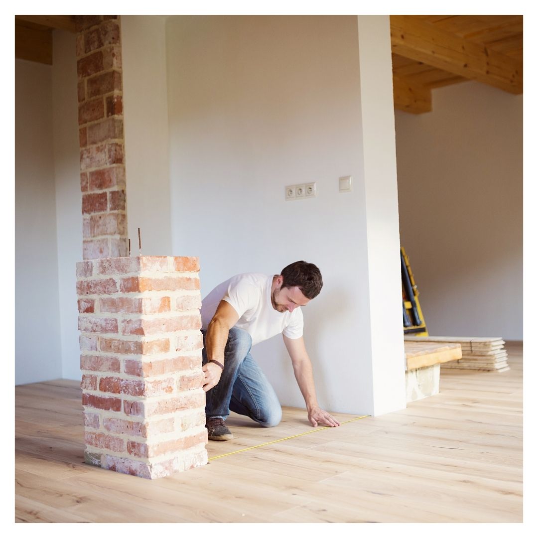 man measuring room