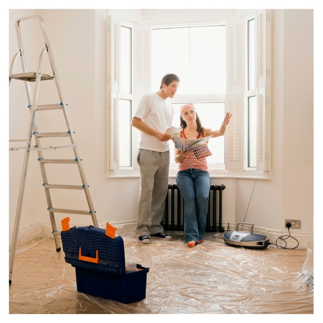 couple figuring out heating needs of room