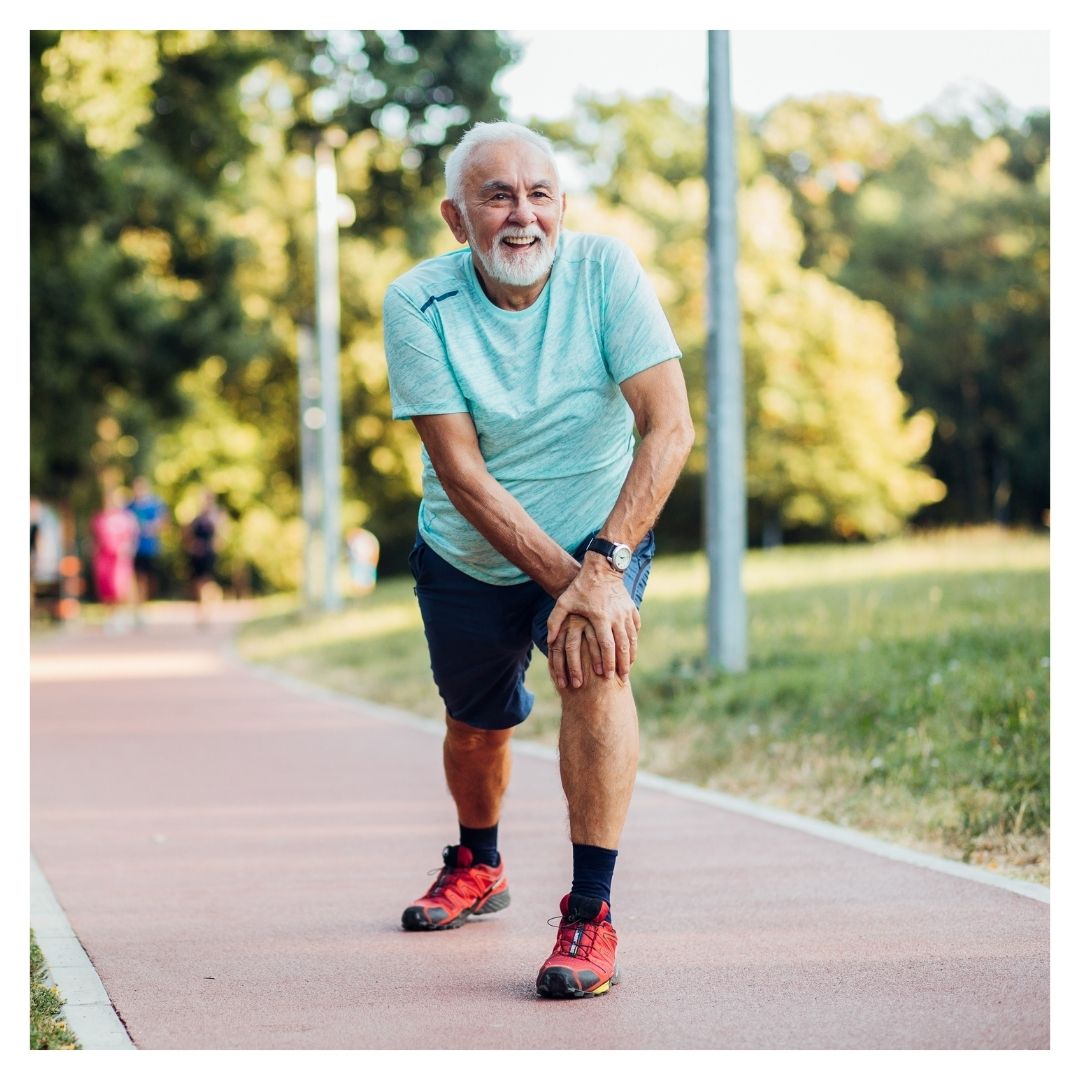 senior man stretching knees