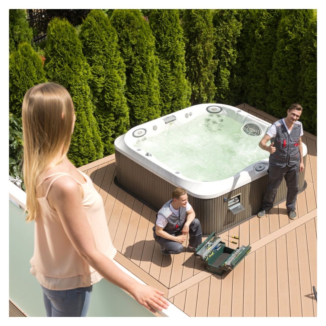 technicians installing customer's hot tub