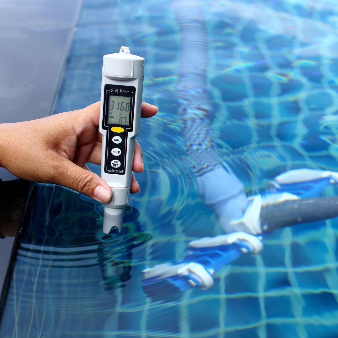 A pools water being tested with a tool
