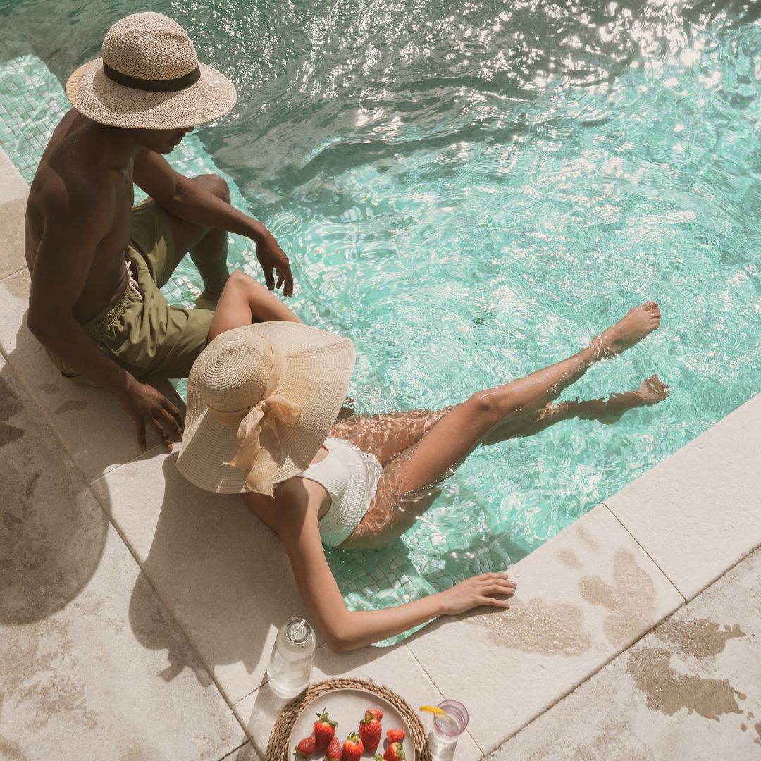 A couple relaxing pool side
