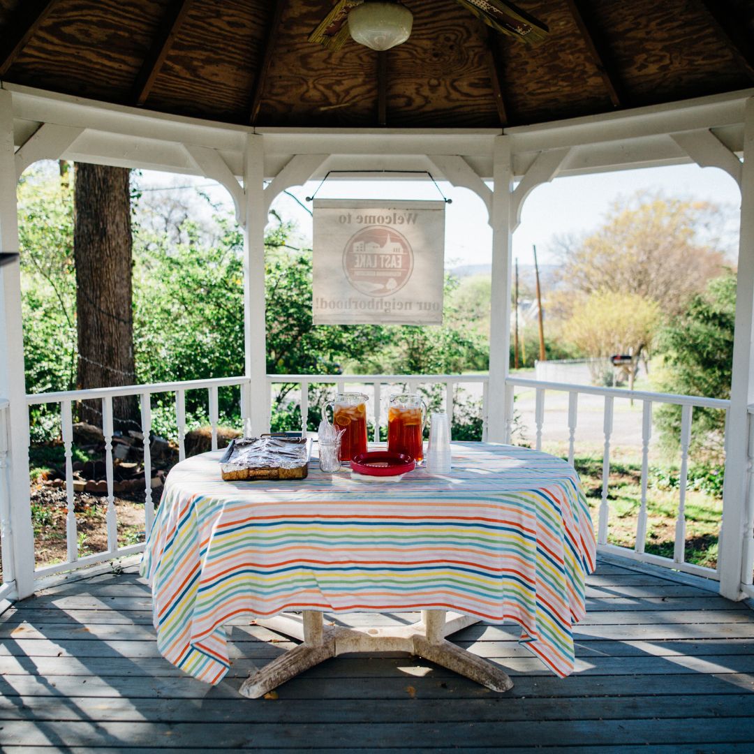 A backyard gazebo with a table in the middle