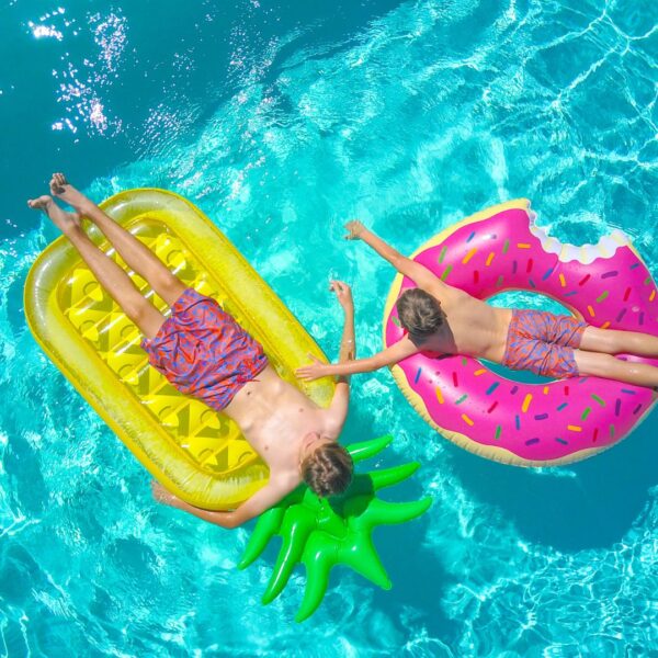people on pool floaties