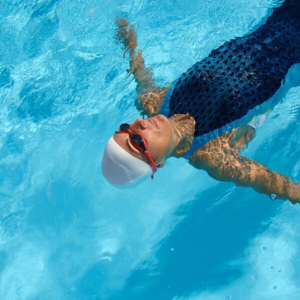 woman floating in swim spa