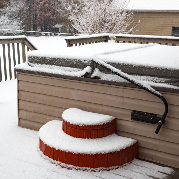 Covered hot tub with snow surrounding