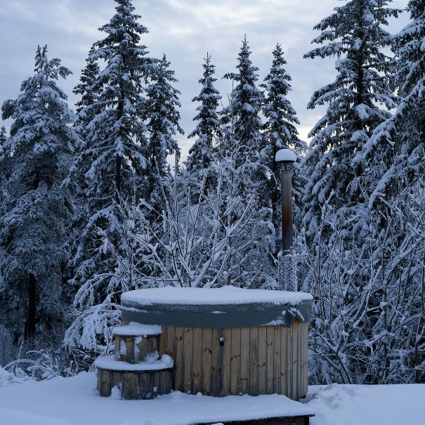 Covered hot tub with snow surrounding
