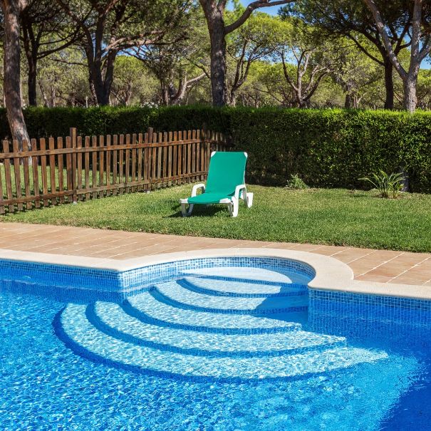Lush grass surrounding a pool